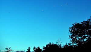 UFO lights above treeline